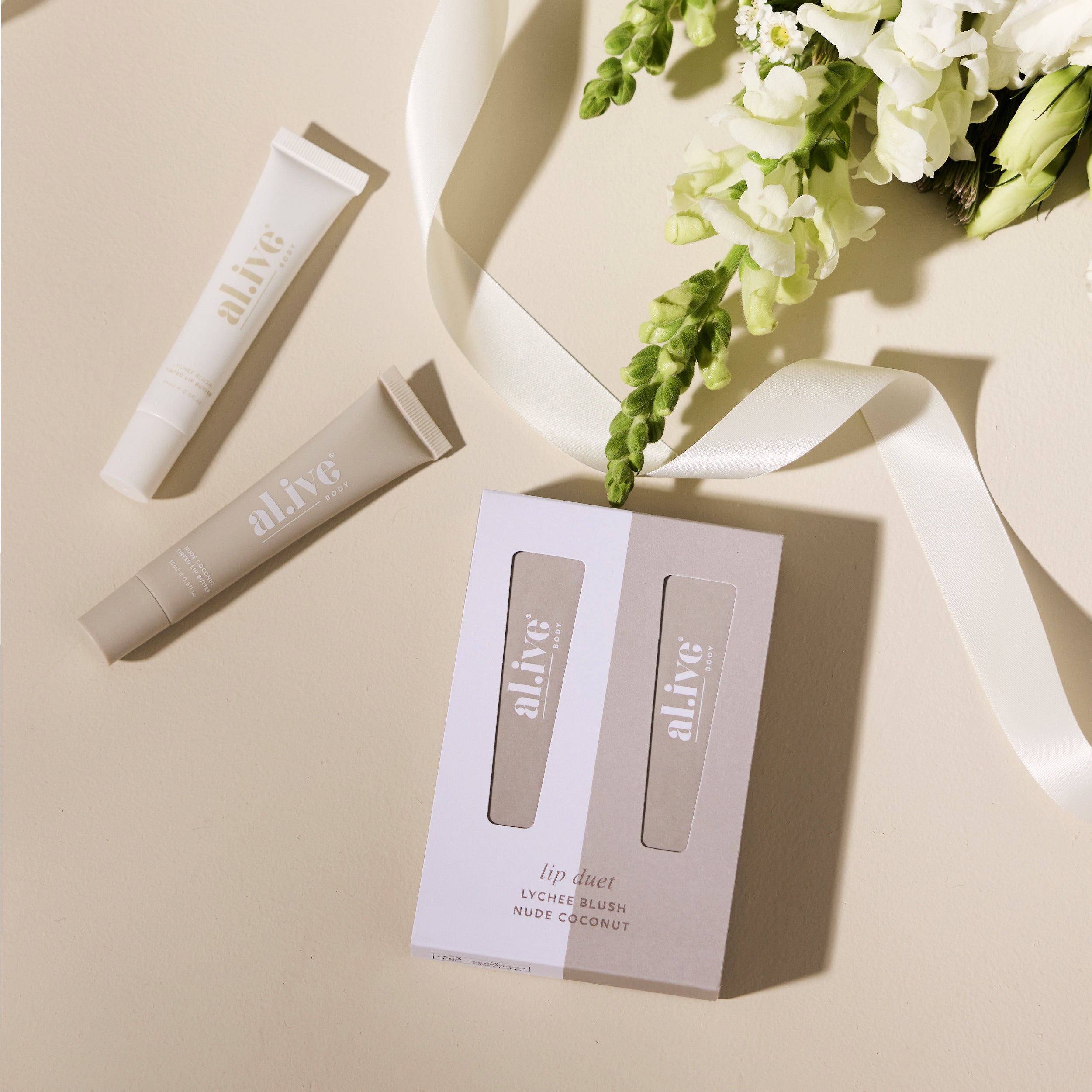 Al.ive Body Lip Duet - Lychee Blush + Nude Coconut